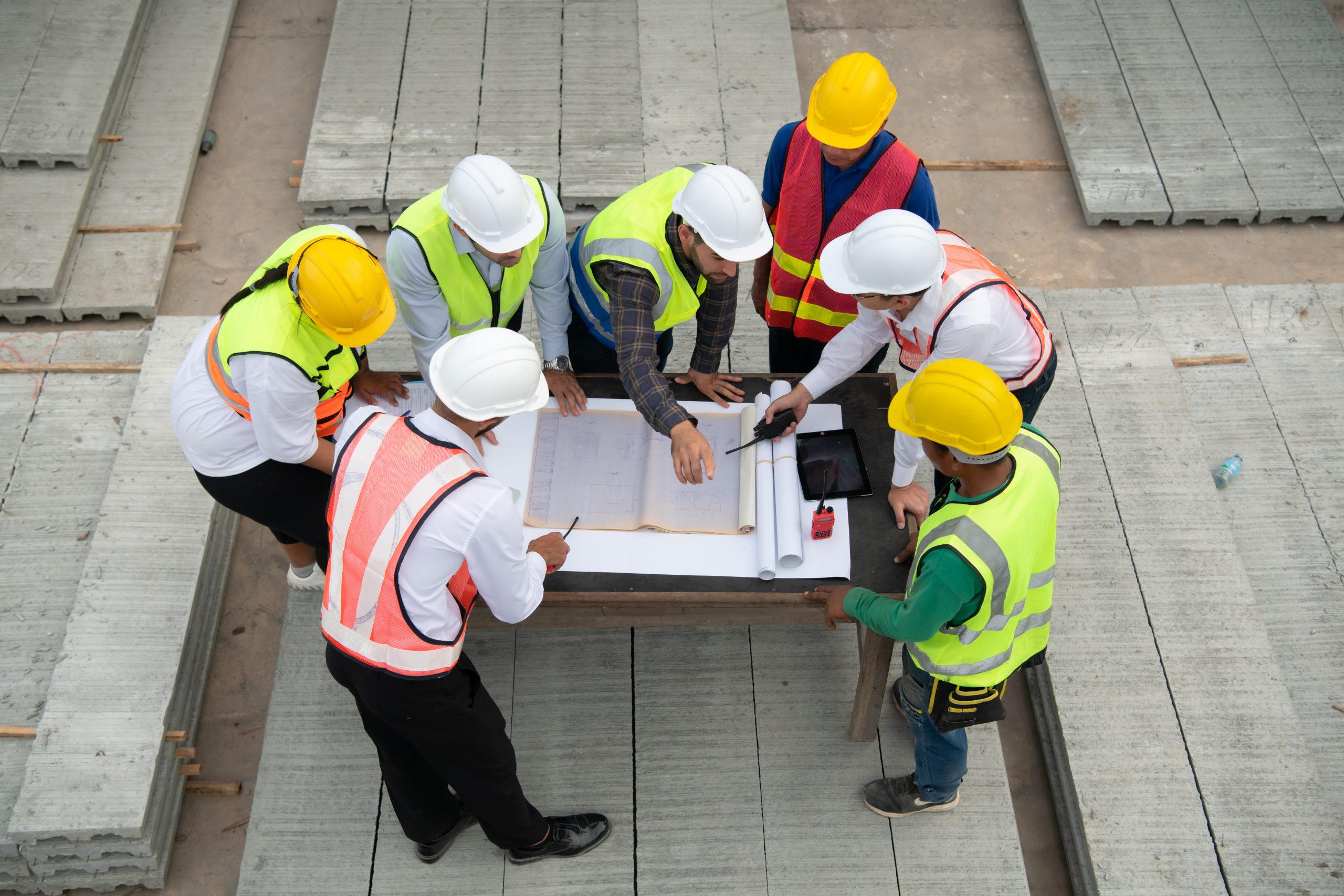 construction engineers, architects, and foremen form a group. pa