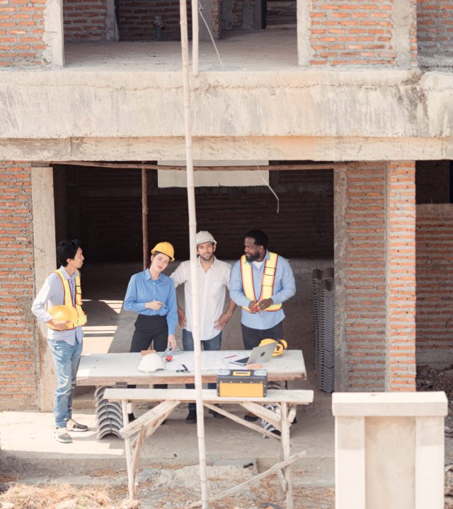 group of architects and engineers work together to assess the re